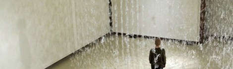 Art student views shadow play of hot glue installation titled Numinous by Gerri Sayler at Spurgeon Art Gallery