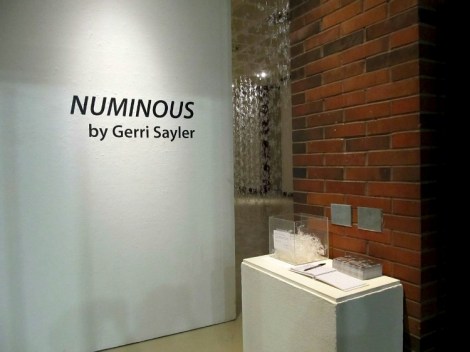 entrance view of hot glue installation titled Numinous by Gerri Sayler